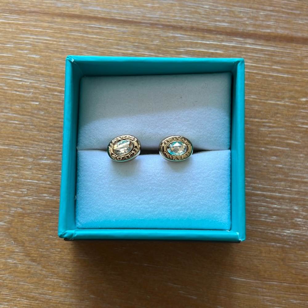 Coach champagne crystal stud earrings